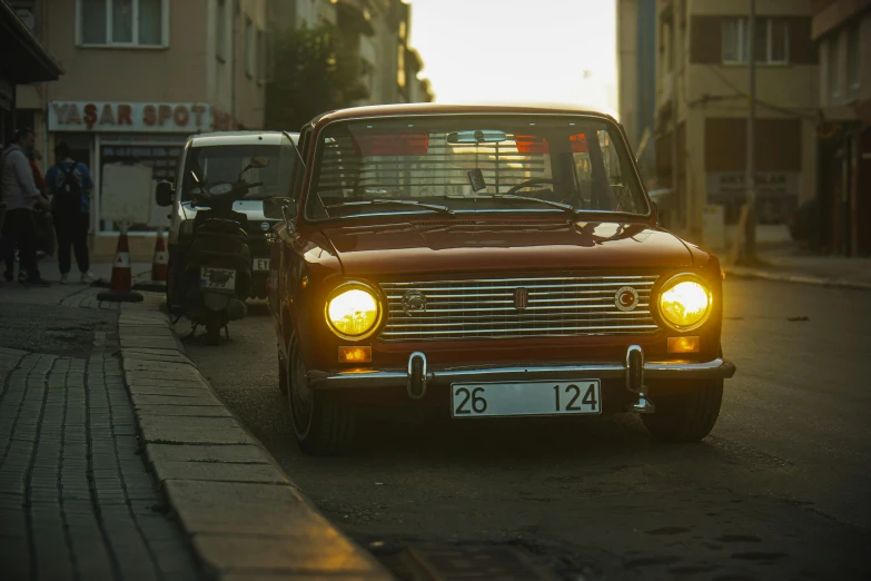 an old car parked on the side of a road