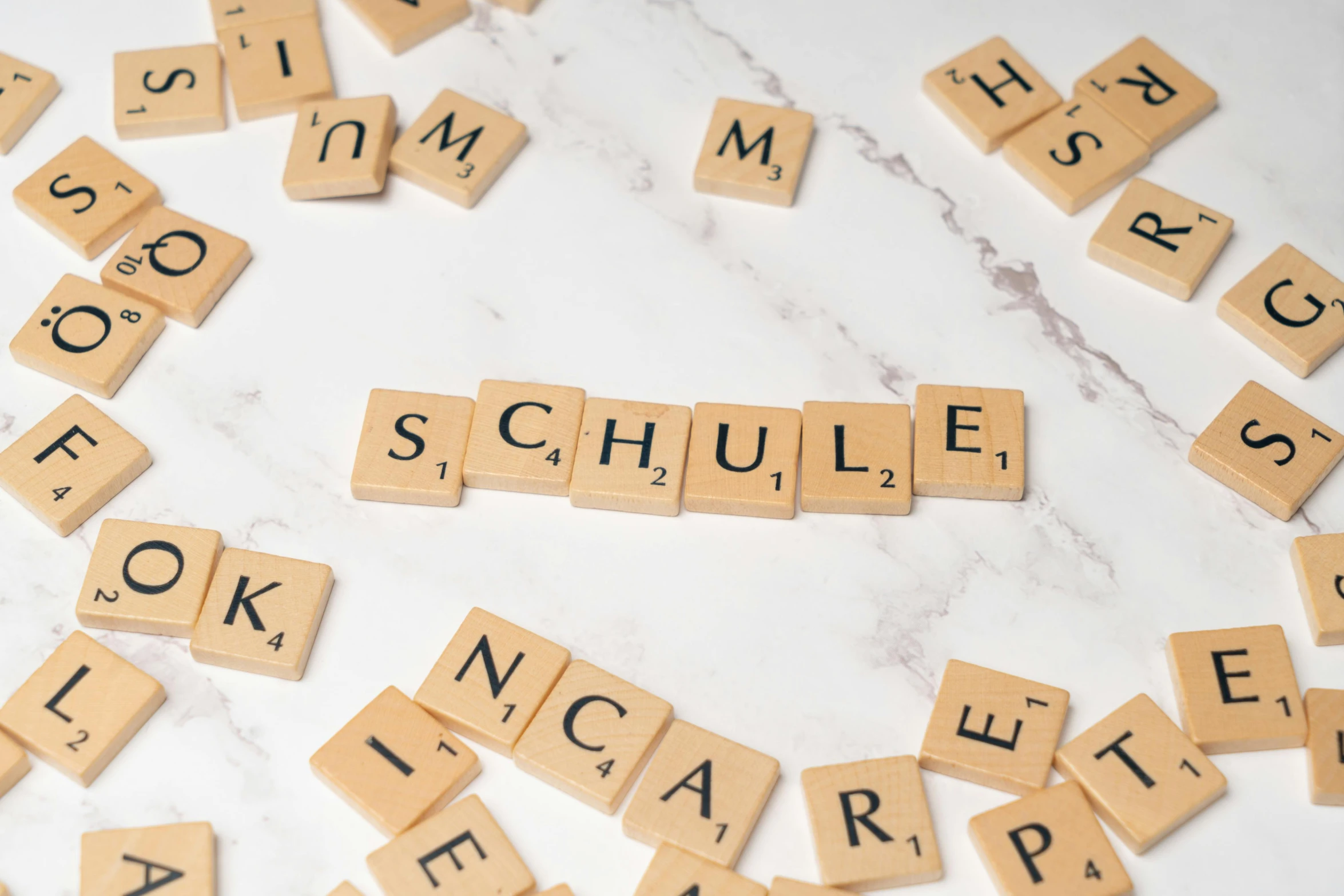 scrabble letters spelling schnute spelled with wooden scrabble tiles