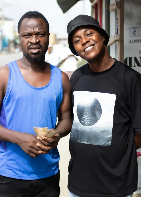 two men standing in front of a restaurant with an ice cream cone