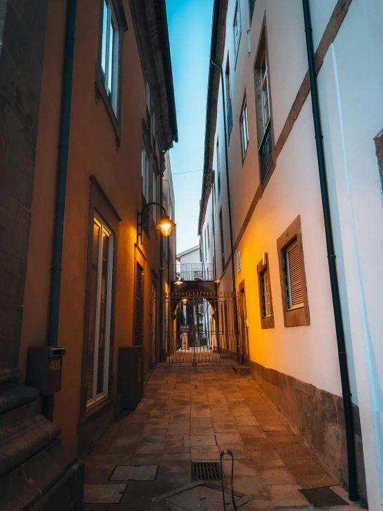 an alley that has several lights on each side of it