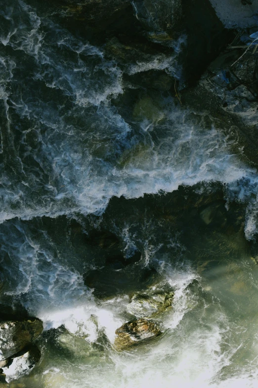 the sea water is rushing in to a beach