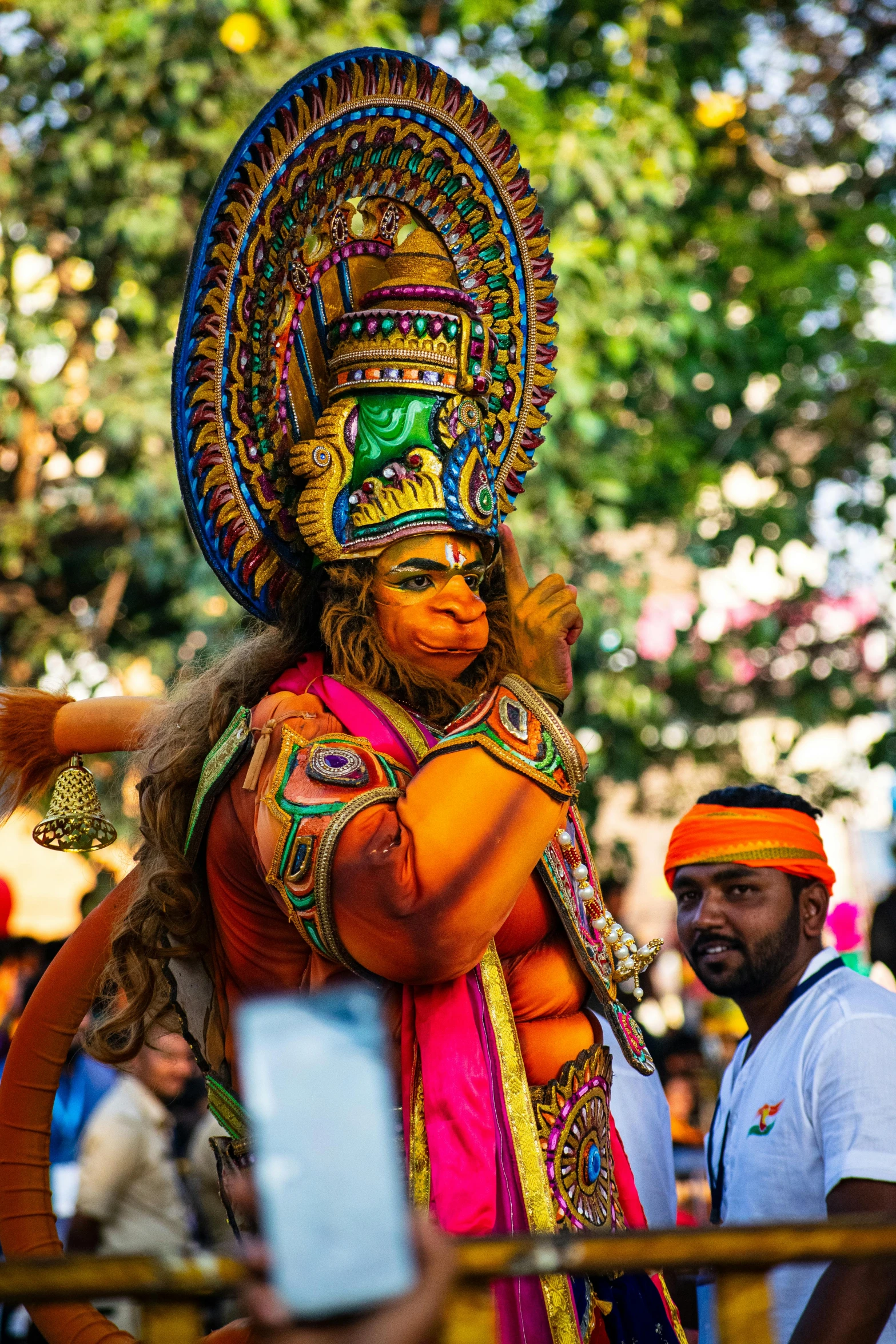 a person in a colorful costume standing near others