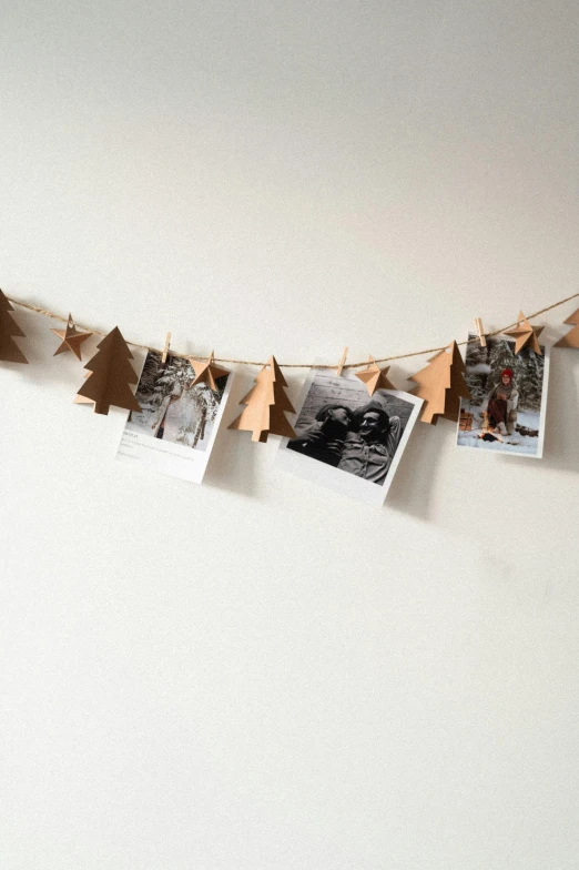 garland with trees that have been cut and hung on a line