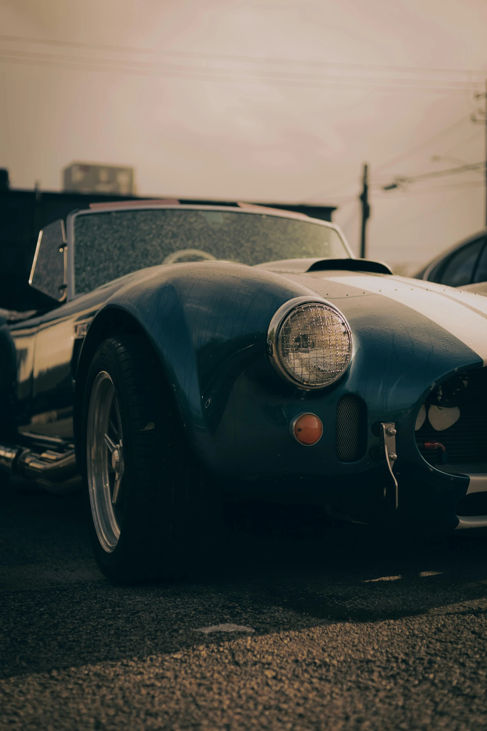 a classic sports car parked on the road