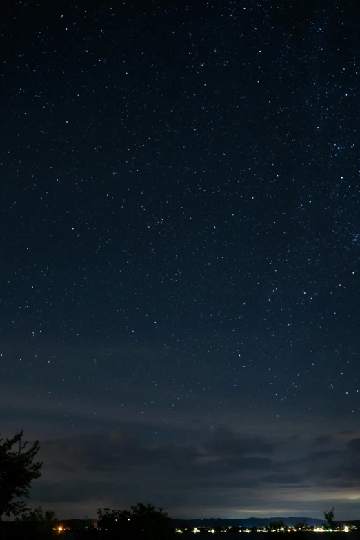 there are many stars above the buildings on this night