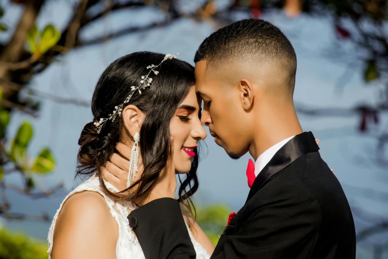 the bride and groom are close together