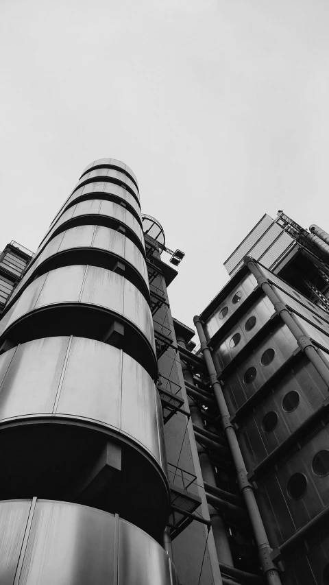 a very tall building sitting next to another building