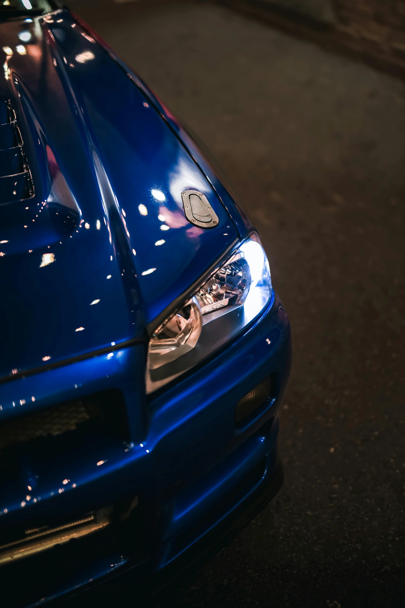 a close up s of the grilles on a blue sports car