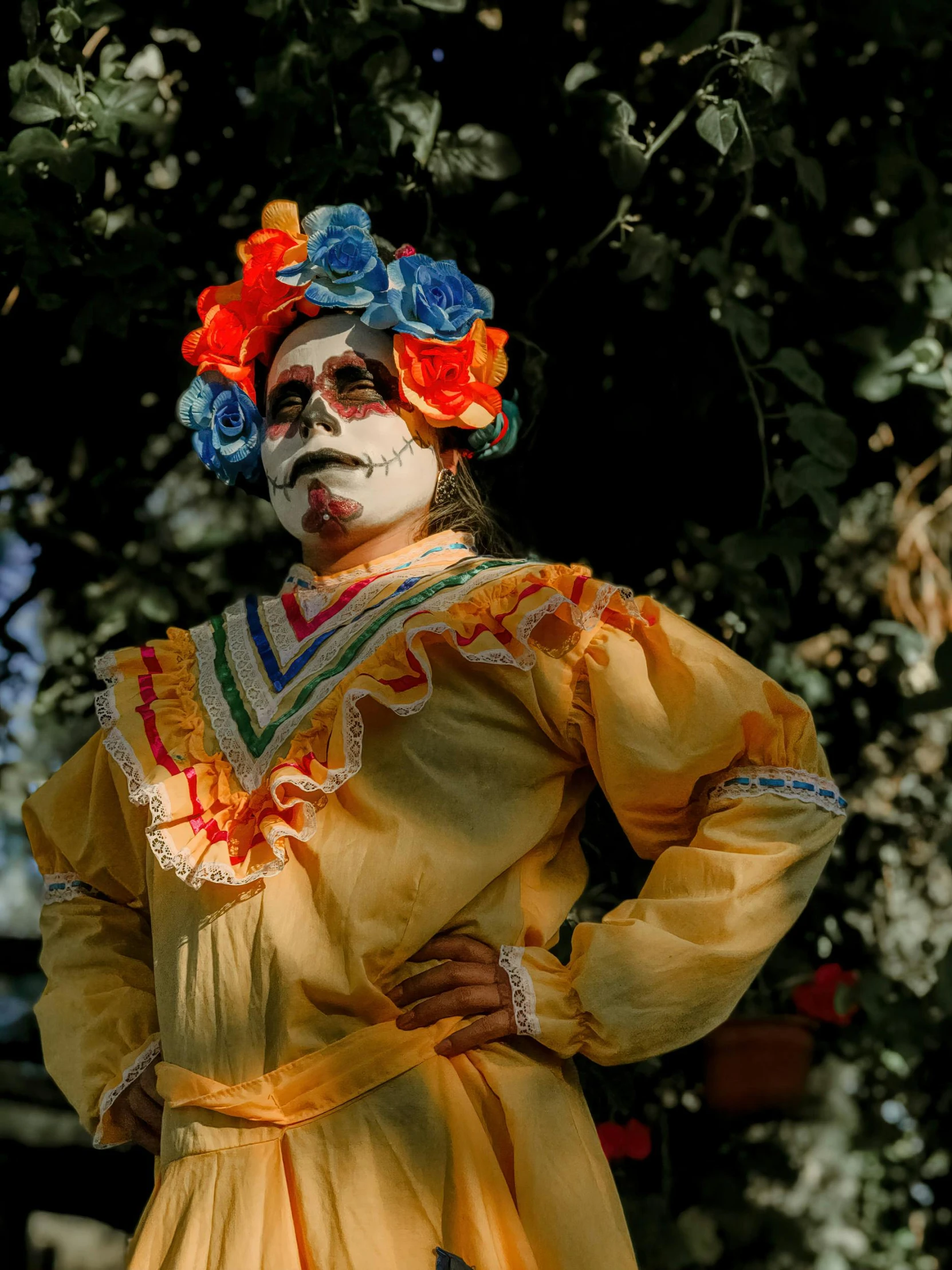 a man dressed in a colorful mexican outfit