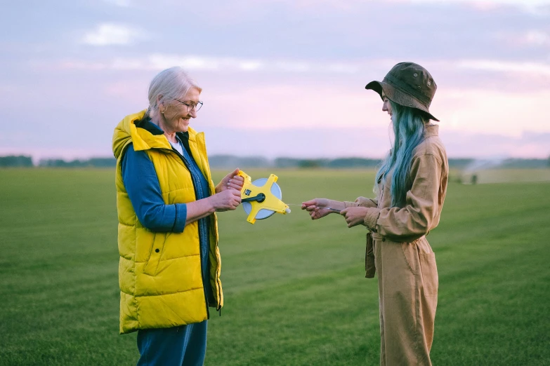 a couple of people on a field with remotes