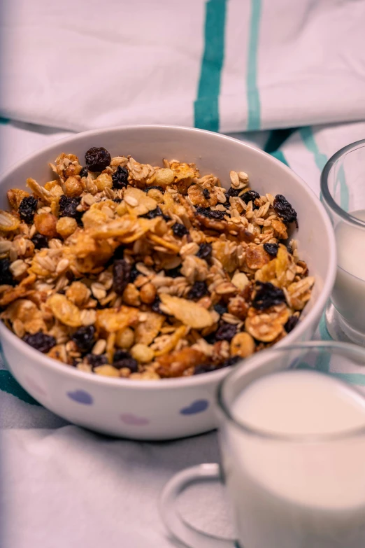 a bowl of cereal next to some milk