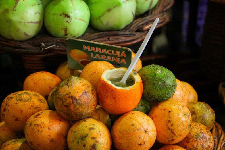 a pile of different colored fruits sitting on display