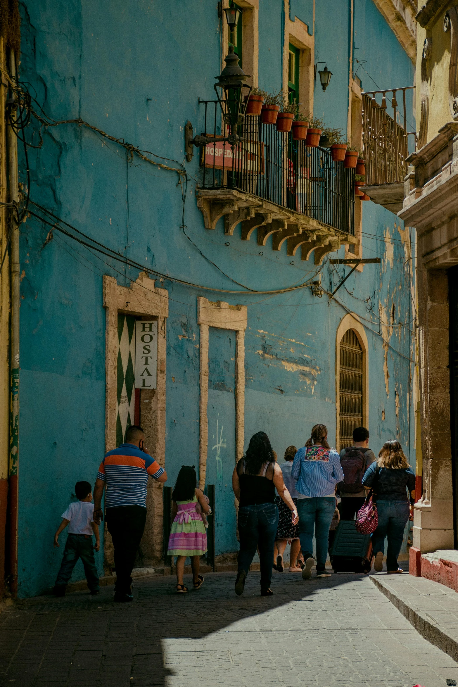 an image of people that are walking down the street