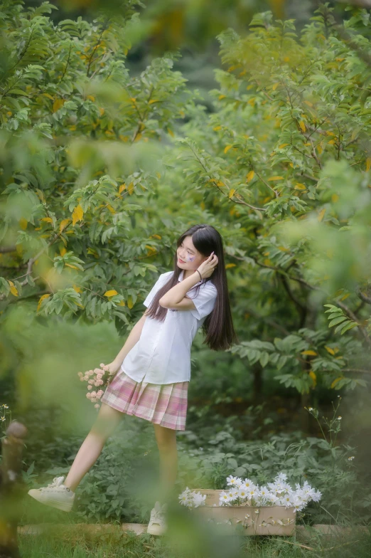 a little girl is standing in the grass