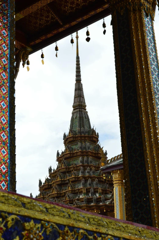 a large temple is shown through an opening in the frame