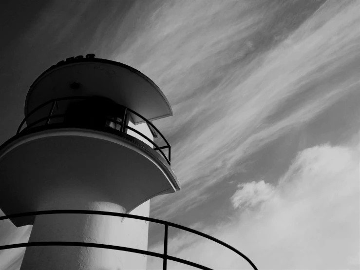 an abstract image of a light house with an observation deck