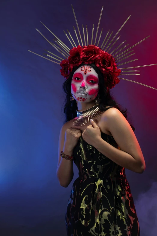 an attractive young lady with skull makeup wearing a headpiece