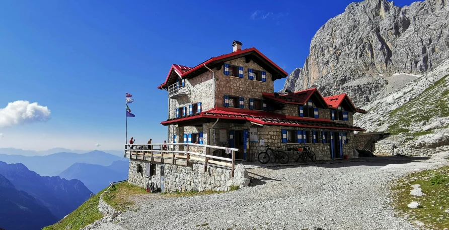 a small house on top of a hill