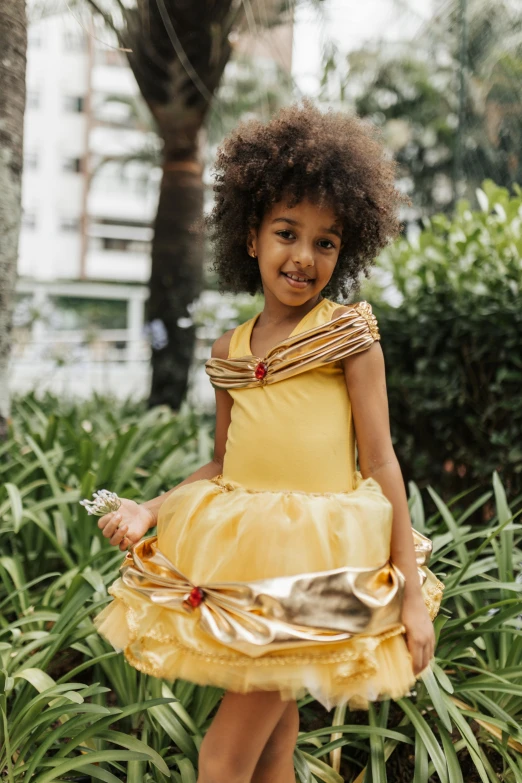 little girl in yellow dressed in a dress