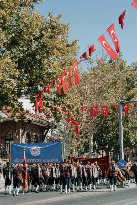 people walking down a street in a parade