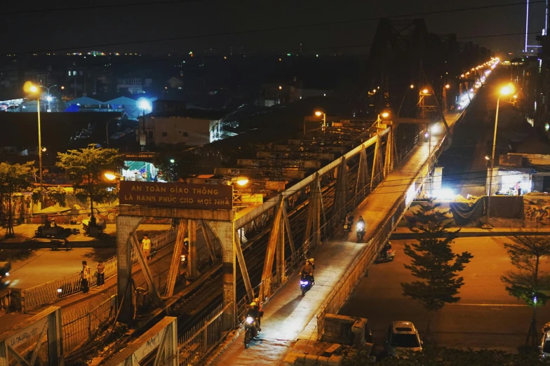 a train passing by a group of streetlights at night