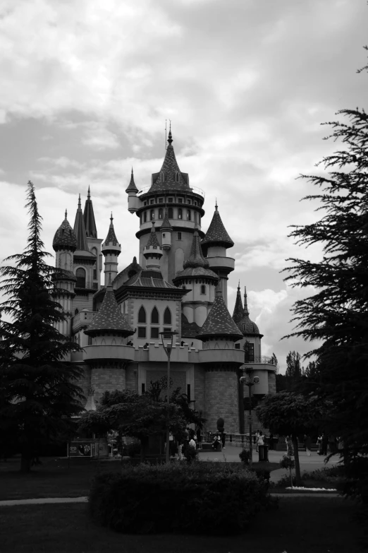 large building with towers on a cloudy day