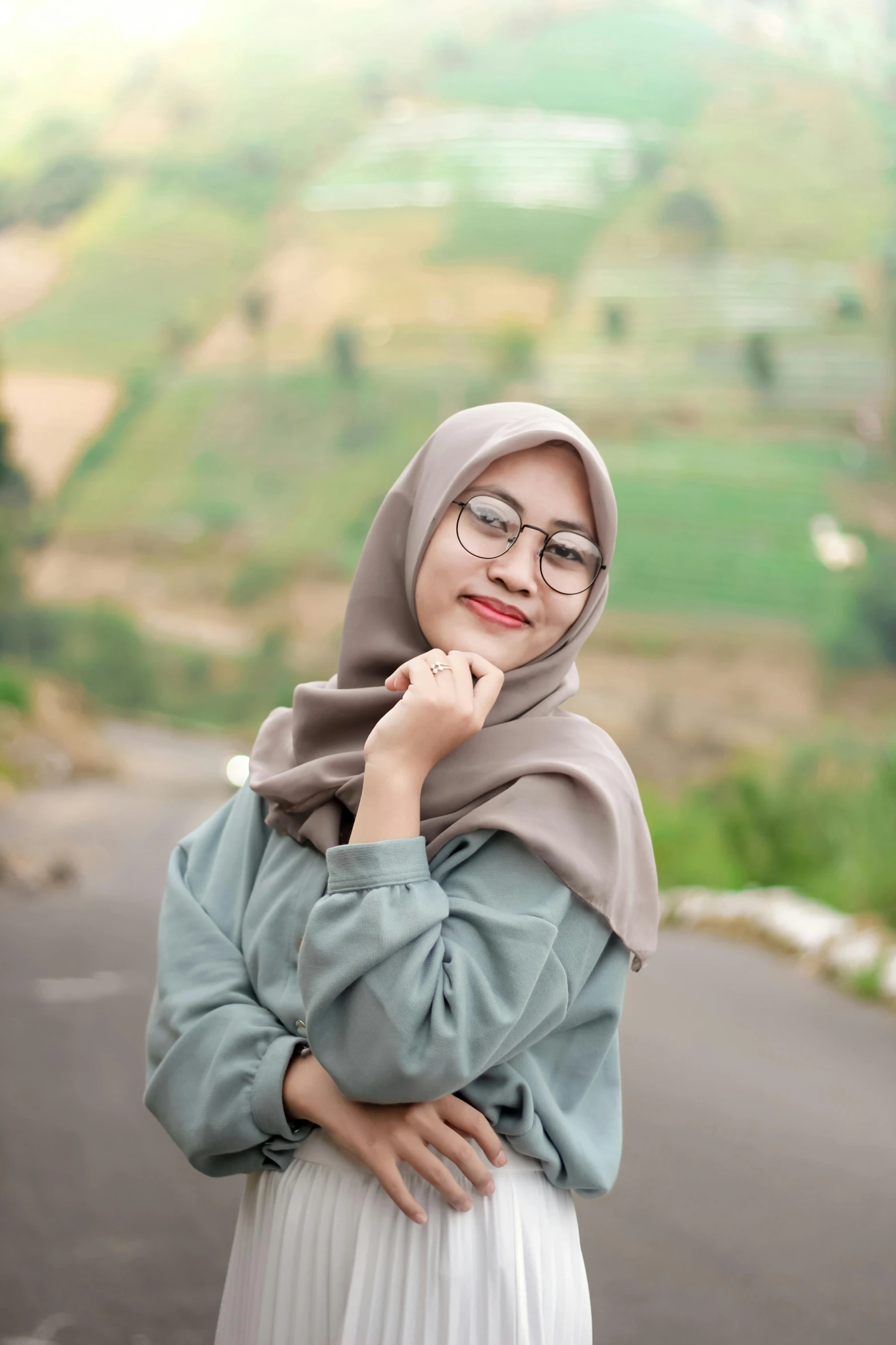 woman in hijab posing on the side of the road