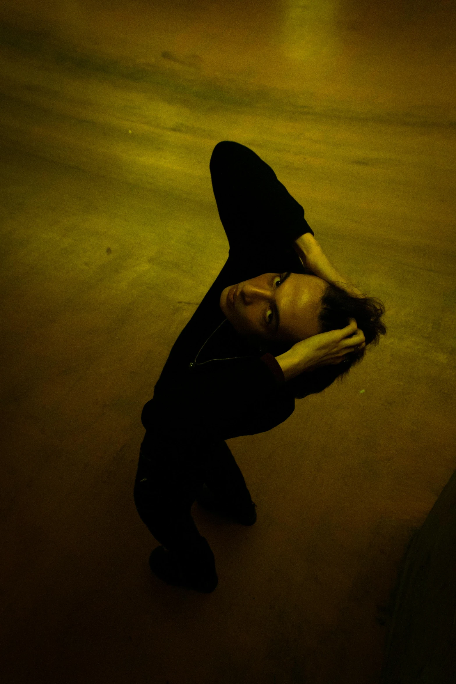 a woman with her hands resting on her back