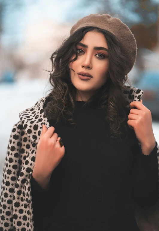 a girl in leopard print coat, black turtle neck shirt and brown hat