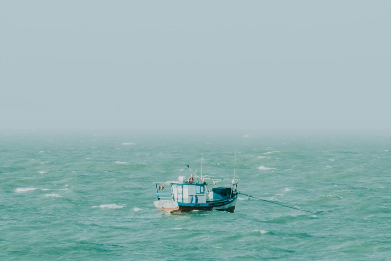 a large boat in a vast ocean full of water