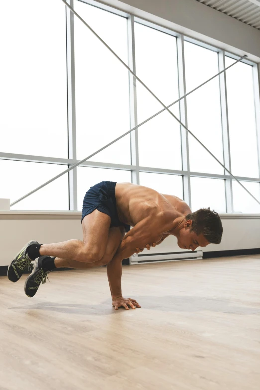 a man doing planky exercises on the floor