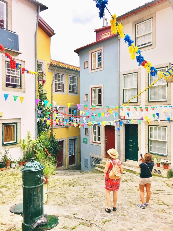 two people standing in the middle of an empty street