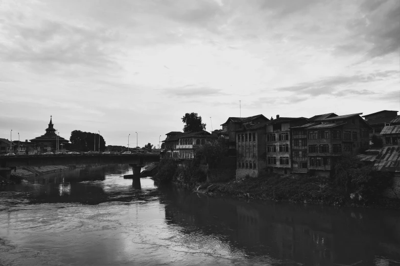 a river that has some buildings in it