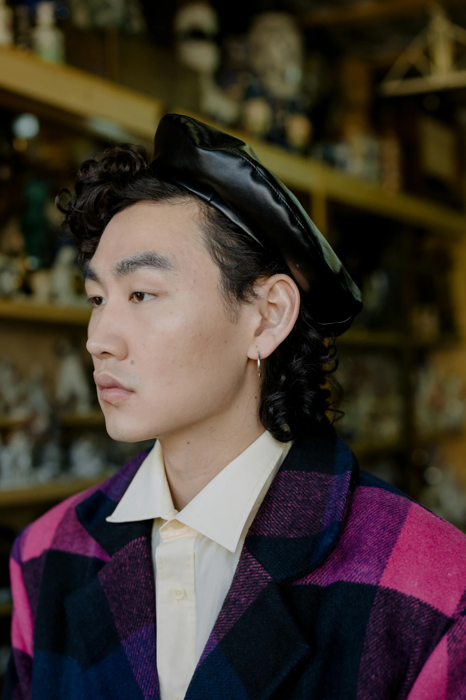 a man wearing a hat in a store