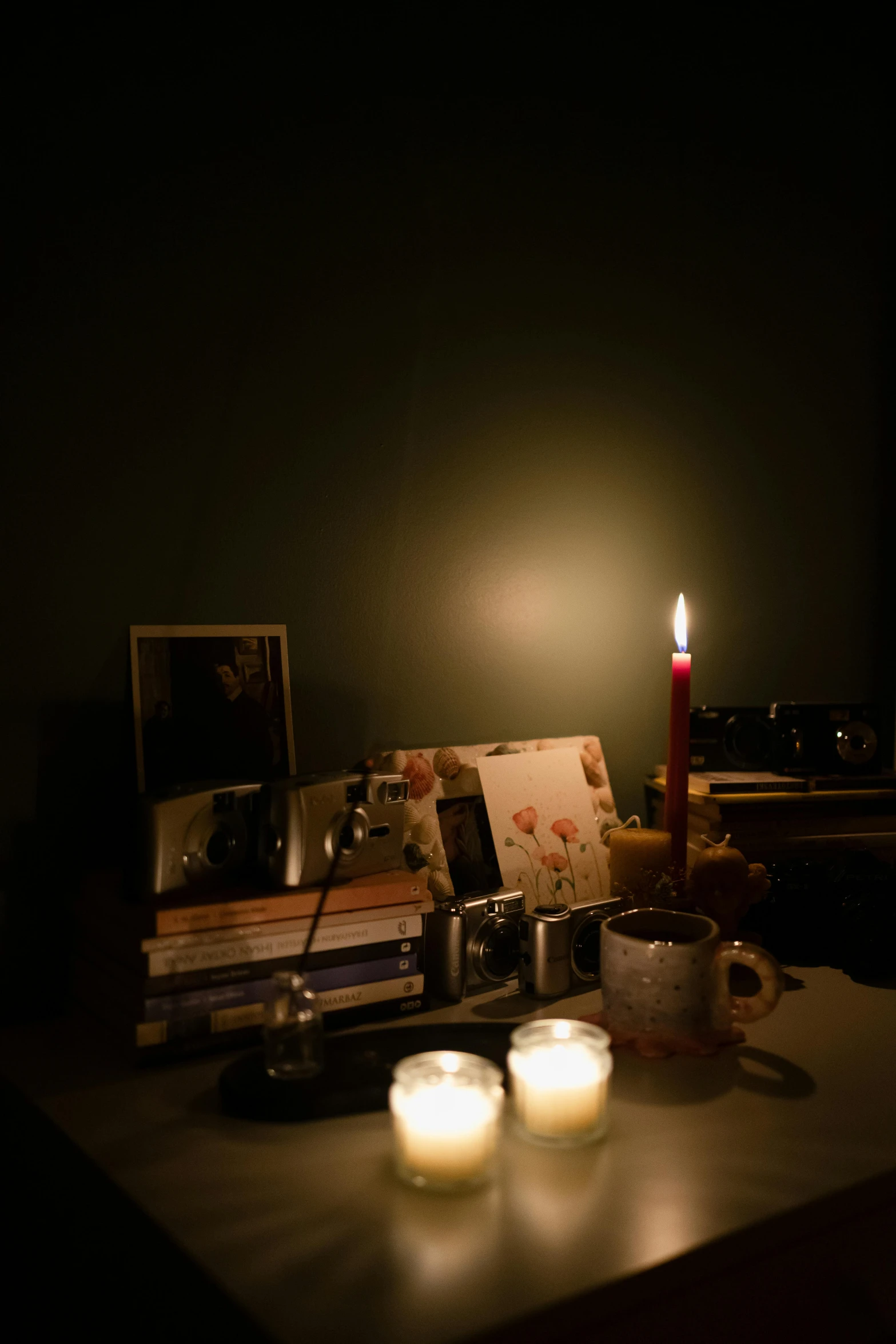 a couple of candles that are on top of a table