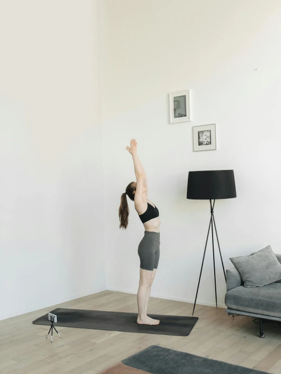 a woman doing yoga in her living room