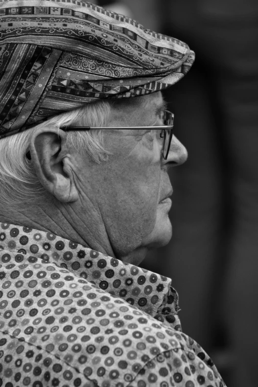 a black and white po of a woman wearing a hat