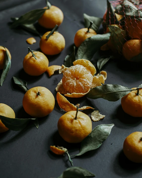 fruit with leaves on a table that is used to make jewelry