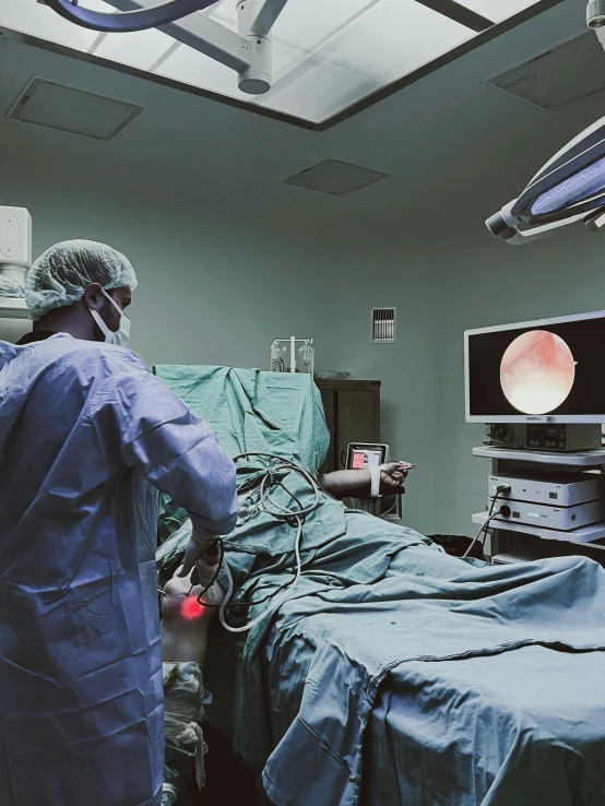 medical personnel tending to an injured patient in an operating room