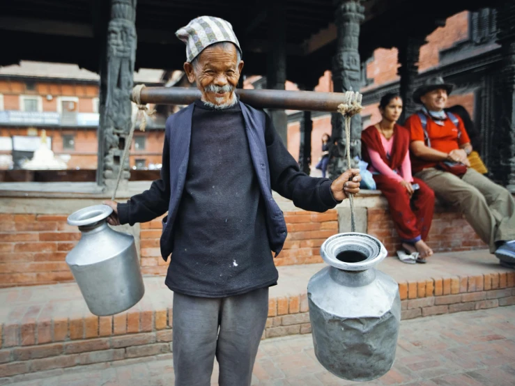 an old man with his hands on the handle