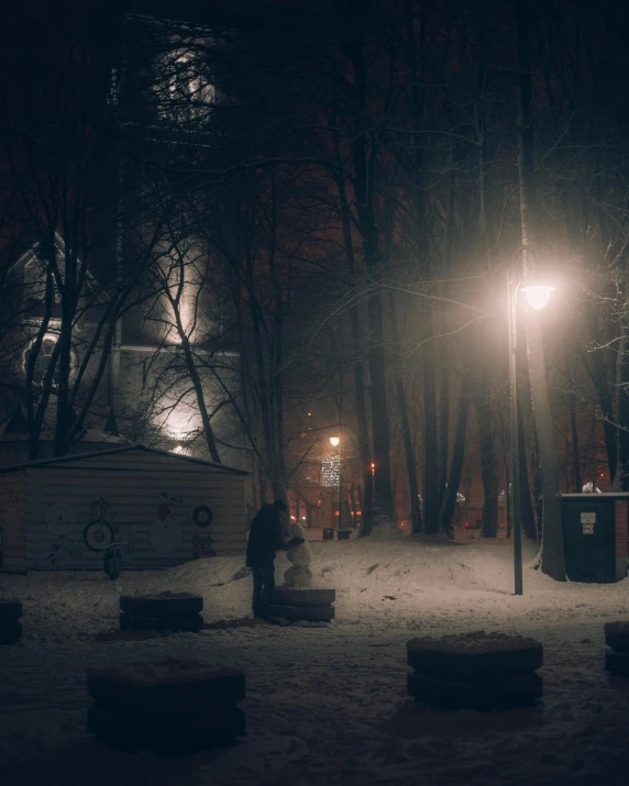 a street with some benches and lights on it