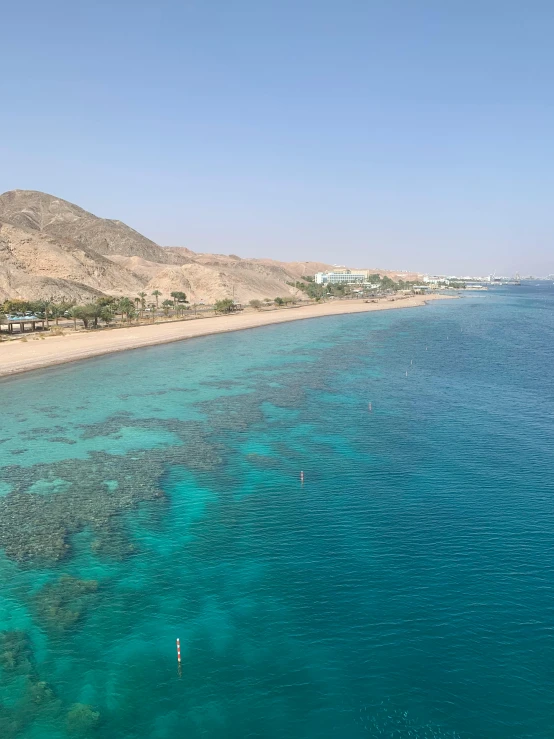 the calm ocean water is crystal blue