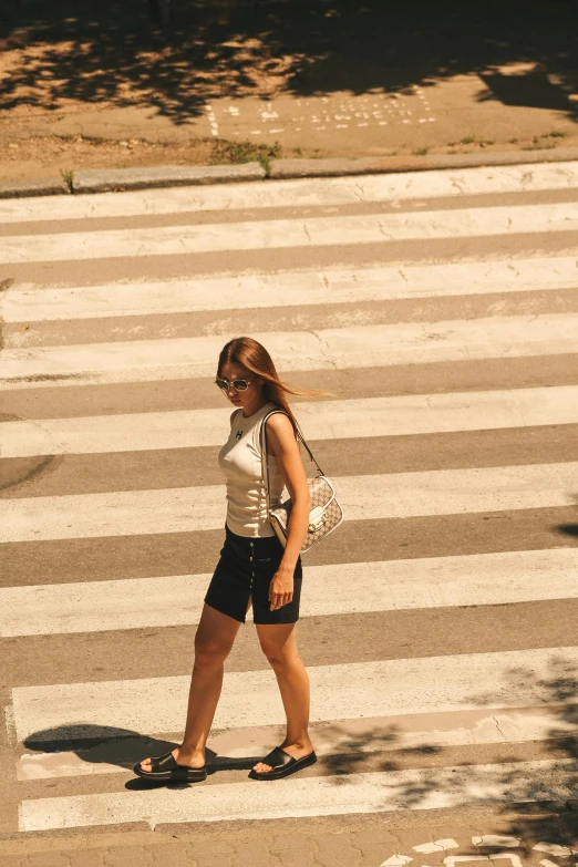 a girl standing in the middle of a street