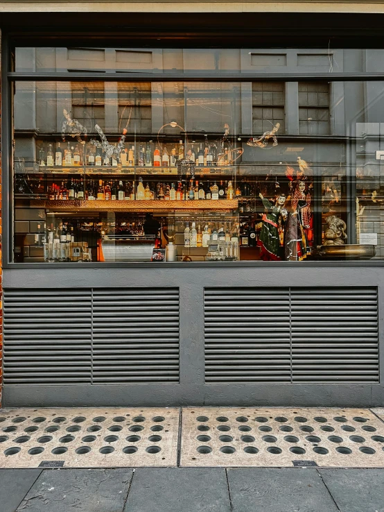 a store window showing an assortment of bottles