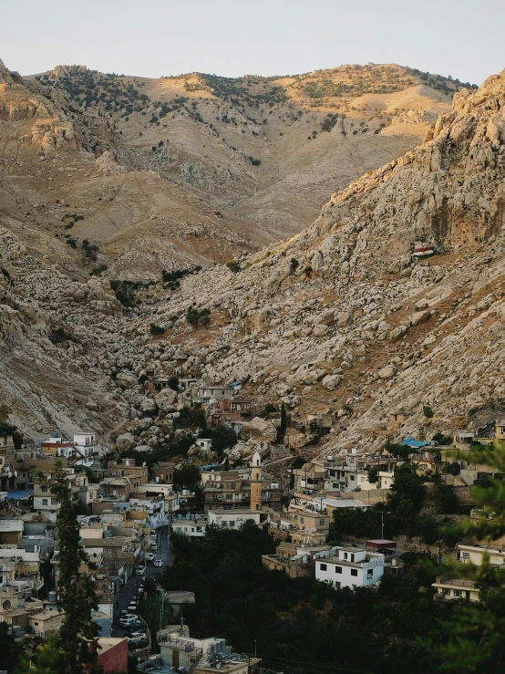 some very tall mountains with a small town below