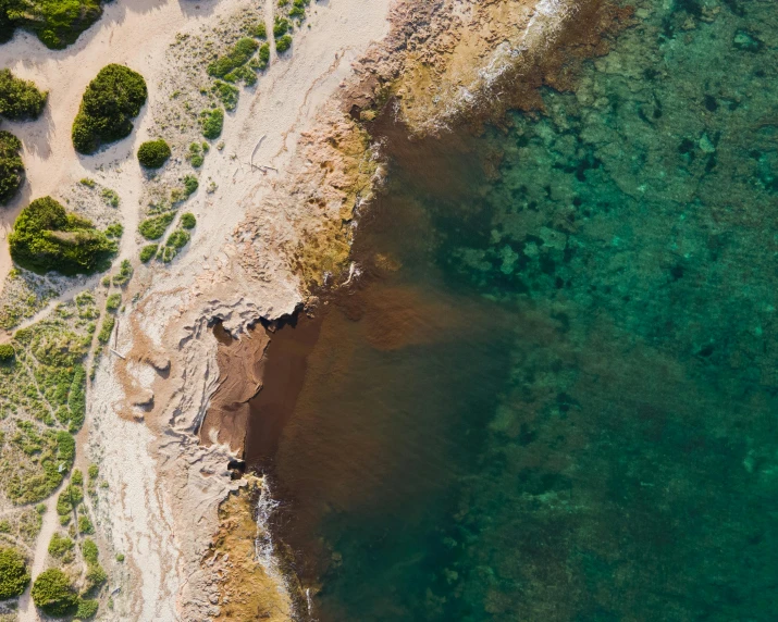 an aerial view of a river and beach