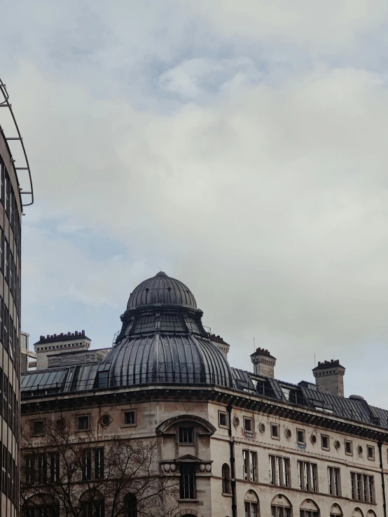 the dome of an ornate building with a steeple on it