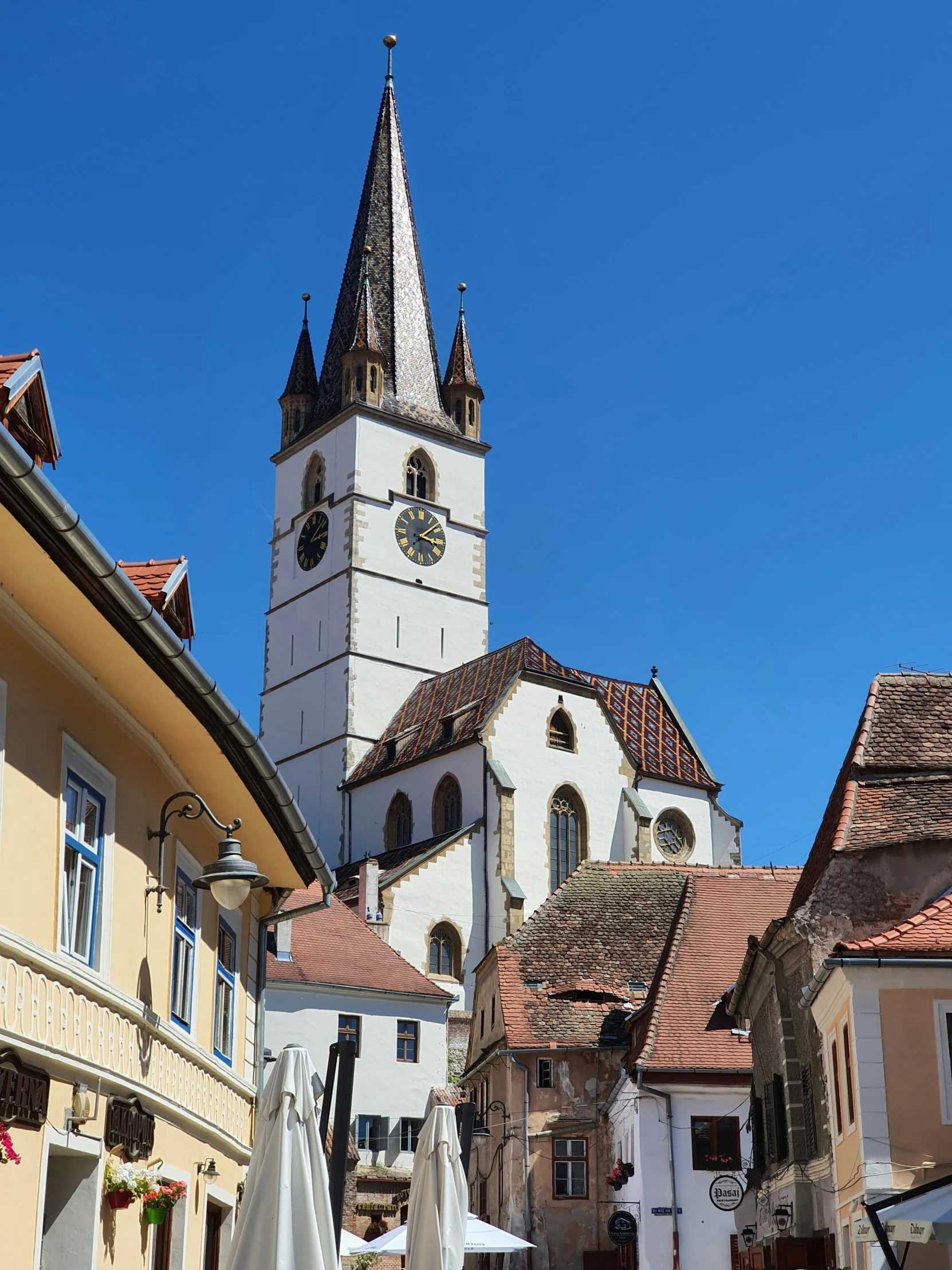 old buildings are in the distance with an spire