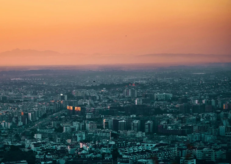 a city is at dusk and the skyline of a large city