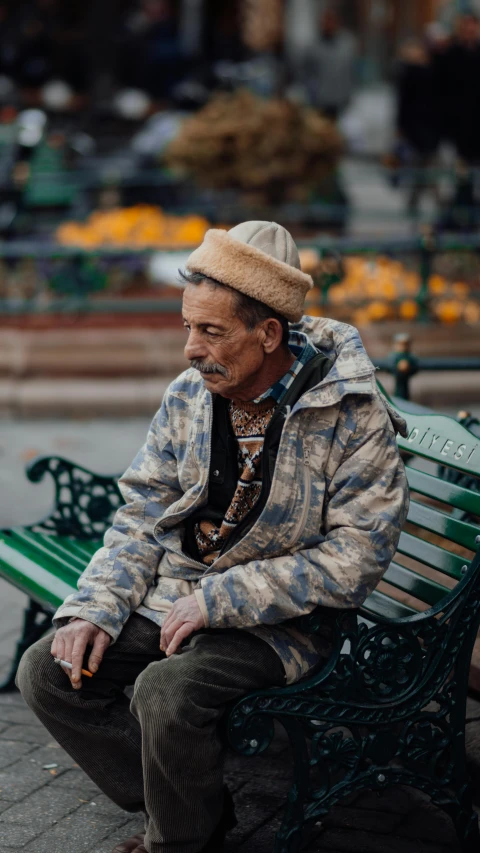 a man in the middle of a park bench